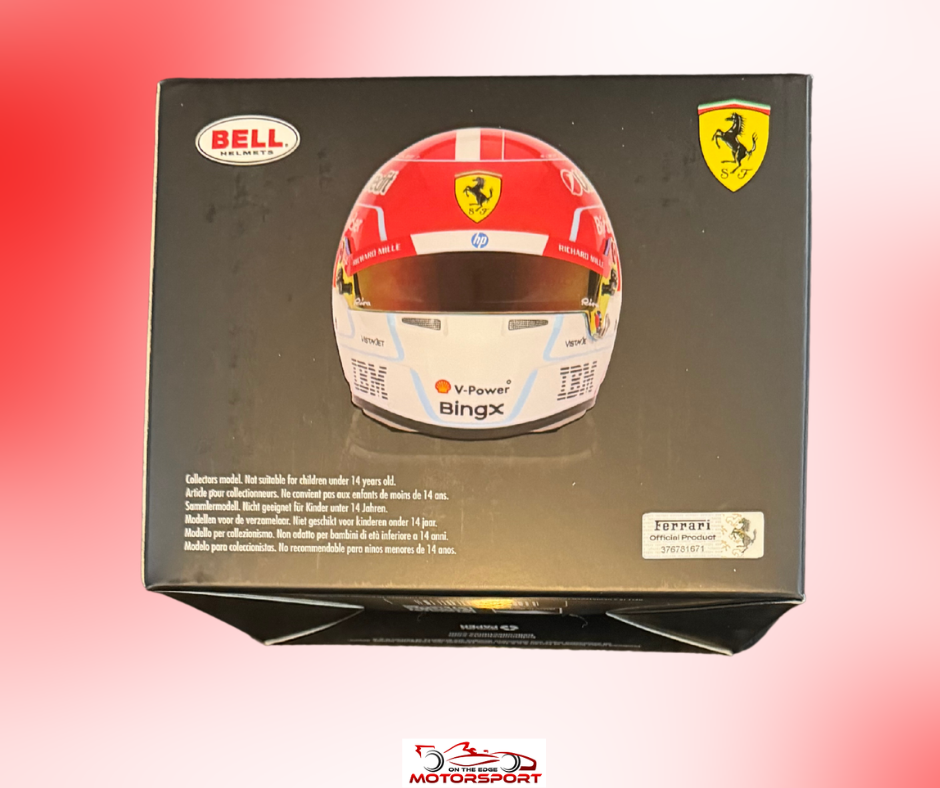 A boxed Bell Ferrari 009 scale model car kit, showing the retail packaging with a printed image of the red and white racing helmet on a black box, set against a red-to-white gradient background.